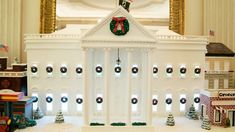 the white house is decorated for christmas with wreaths on it's roof and decorations