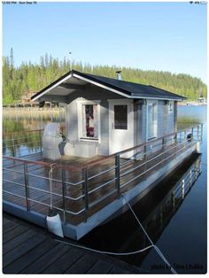 a houseboat is docked on the water