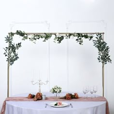 the table is set with flowers and candles