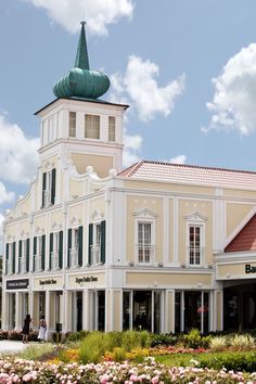 a large building with a green steeple on top