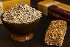 a bowl of oatmeal next to a bar of soap on a table