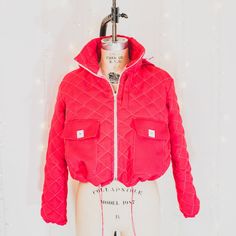 This bright pink, cropped, ski-style coat has that high-fashion look you love, with all the warmth and comfort winter requires. "Cliff-Hanger" features a flattering boxy fit complete with a drawstring for a transformed waistline. It also features a quilted outer layer with contrast stitching, a detachable hood, and a stunning light pink inner lining. SIZING: This garment is MADE TO ORDER just for you. During purchase, select the size you generally order (this is just for our reference), and we w