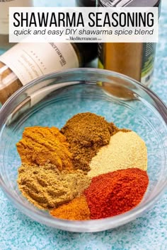 spices in a bowl next to bottles of wine