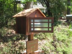 a mailbox in the middle of a wooded area