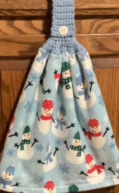 a blue dress with snowmen on it