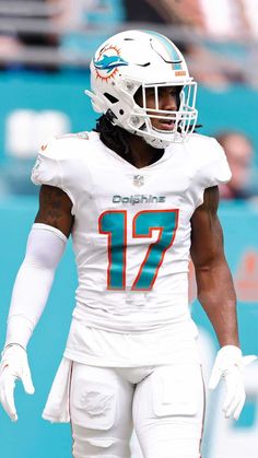 miami dolphins running back to the sidelines during a game