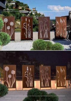 three panels with flowers on them are lit up at night and the same panel is made out of wood