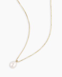 This elegant Pearl Charm Necklace has a 14k solid gold chain and a dangling pearl charm, perfect for a dress-up night out or a dip in the ocean. This necklace is as versatile as it is timeless. Pearl Necklace in 14k Solid Gold, Women's by gorjana Gorjana Necklace, Turquoise Birthstone, Pearl Charm Necklace, Pearl Birthstone, Statement Rings Diamond, Solid Gold Chains, Pearl Pendant Necklace, Pearl Charms, Diamond Hoop Earrings