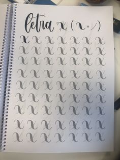 a spiral notebook with the words etta written in cursive writing on it