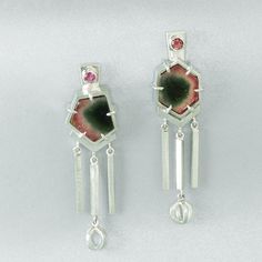 Specifications: Metal: Sterling Silver Stones: Natural Bi-color Tourmaline Slices, 6.73cttw; Natural Pink Tourmaline Rounds, 3mm Size: 1 7/8in drop x 1/2in width Tourmaline is not just for October babies. The verdant garden of colors in these inverted watermelon tourmaline earrings is positively springlike. The mismatched tourmaline centerpieces display center of green from which emanates a faint blue transitioning into a lively pink. Sliced and polished but retaining their original crystal silh Crystal Silhouette, October Baby, Tourmaline Earrings, Stone Setting, Watermelon Tourmaline, Raw Crystal, Fringe Earrings, Deep Green, Pink Tourmaline