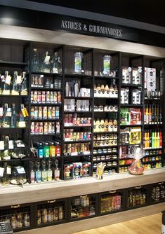 a store filled with lots of different types of condiments and drinks on shelves