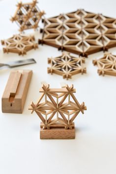 several pieces of wood sitting on top of a table next to a pair of scissors