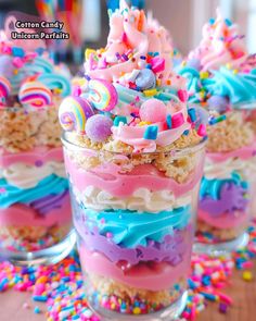 colorful desserts in small glass cups with sprinkles and candy on top