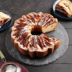 a bundt cake on a plate with two slices cut out and ready to be eaten