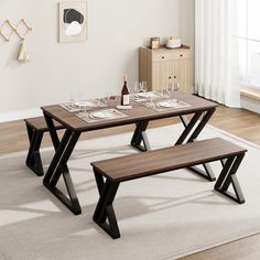 a wooden table with two benches in front of it and a white rug on the floor