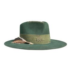 - Felt in western weight in Forest Green- 4.5" crown- 3.5" brim- Pinched crown- 2" distressed + stitched grosgrain band and bow in Moss - Crown ridge stitched in Bronze- Feather bunch with Brown accents - Natural tan leather sweatband- 100% silk interior lining- Sanded to perfection- No mass production, less waste, more love - This product is final sale + not eligible for returns or exchanges. Green Felt Hat Outfit, Moss Crown, Felt Hat Outfit, Feather Crafts, Big Hat, Mass Production, Natural Tan, Outfits With Hats, Felt Hat