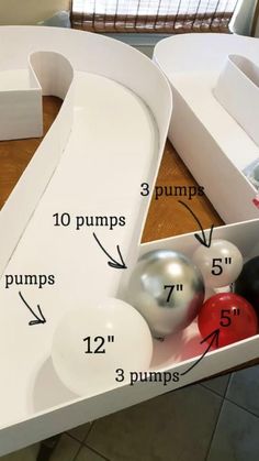 an odd shaped table with balls in it and measurements for the top part of the table