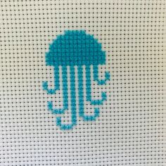 a cross stitch pattern with an umbrella on it