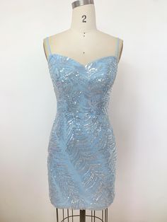 This ice blue sequin mini dress beautifully combines freshness with glamour. The intricate sequin patterns shimmer under the light, creating a dreamy, eye-catching effect. The simple yet elegant design, complemented by delicate straps, adds a touch of femininity. Whether you're attending a party, evening event, or wedding, this dress will make you the center of attention. If you have any special requests or need modifications, please let me know. Sleeveless Light Blue Mini Dress With Sequins, Light Blue Sleeveless Sequin Mini Dress, Blue Knee-length Mini Dress With Sequins, Sequin Embellished Party-ready Bodycon Dress, Spring Blue Embellished Sequin Fabric, Sequin Mini, Sequin Mini Dress, Ice Blue, Elegant Design