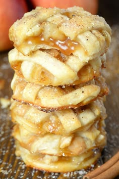 stack of apple pies with cinnamon on top