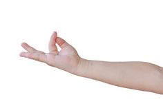 a hand holding something in the air with it's fingers extended out to form an ok sign