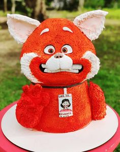 a red stuffed animal sitting on top of a table