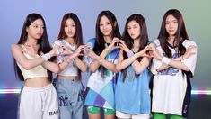 the girls are making heart shapes with their hands