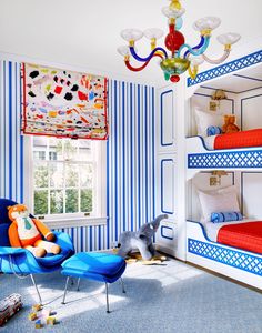 a bedroom with blue and white striped walls