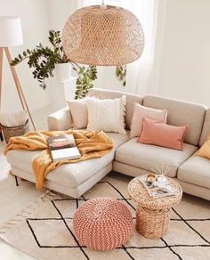 a living room filled with furniture and pillows