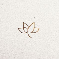 a logo for a yoga studio with two leaves on the front and back of it