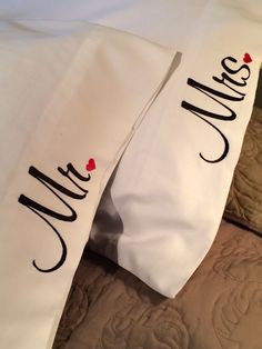 two pillows that have the words mr and mrs on them