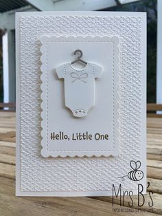 a card with a baby's shirt on it and the words hello, little one