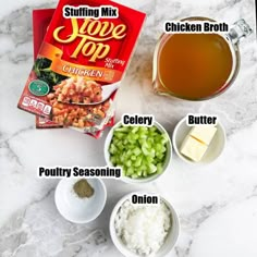 ingredients to make chicken broth laid out on a marble counter top