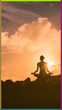 a person sitting in the middle of a field doing yoga