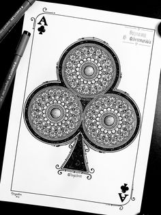 a black and white drawing of a four - card playing card with an intricate design