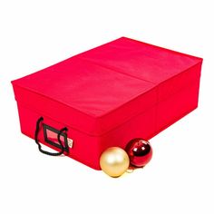 a red storage box with christmas ornaments on the bottom and one gold ornament