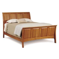 a bed with wooden headboard and foot board