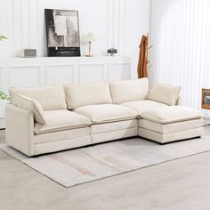 a living room with a white couch and rug