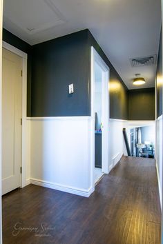 an empty room with hard wood flooring and white trim on the walls is shown