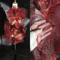 a mannequin made out of red sheer fabric