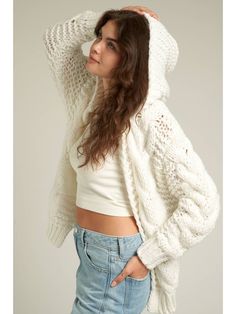 The Callie Cardigan is designed with a hood and fits oversized Hooded Soft Knit Cardigan For Cold Weather, Hooded Soft Knit Cardigan, Oversized Hooded Casual Cardigan, Cozy Cotton Chunky Knit Outerwear, Cozy Chunky Knit Cotton Outerwear, Cozy Hooded Knit Cardigan, Spring Casual Cardigan With Drawstring Hood, Slouchy Casual Winter Cardigan, Oversized Hooded Cardigan For Layering