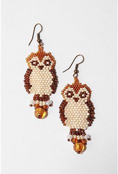 the beaded owl earrings are brown and white