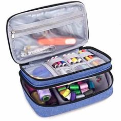 an open blue case filled with lots of crafting supplies in it's side