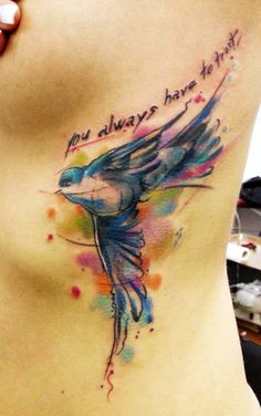 a woman's stomach with a watercolor tattoo on it that says, you always have faith