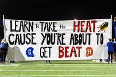 a banner that reads learn to take the heat cause you're about to get beat