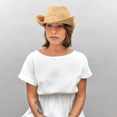 Introducing the Belfry Llina, the ultimate hat for those looking to channel a western, casual style. Made with raffia straw, this packable hat features an adjustable and tieable chinstrap, allowing for versatile wear. FEATURESStyle: Outdoor with Snap-Up BrimMaterial: 100% Raffia Dimensions: 4" Crown, 3" BrimNotes: Brim can be attached to the crown of the hat via snap fasteners on each side. Packable Hat, Pork Pie Hat, Western Casual, Hat Size Chart, Pork Pie, Snap Fasteners, Cloche Hat, Felt Hat, Hat Sizes