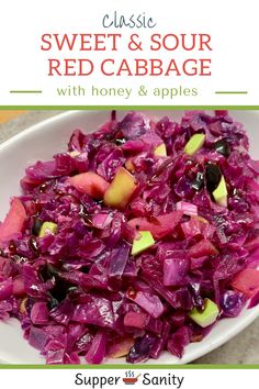 a white bowl filled with red cabbage and apples