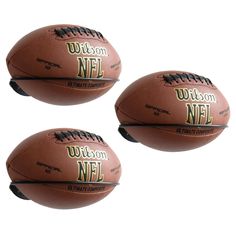 three footballs with the words wilson and nfl written on them are shown against a white background