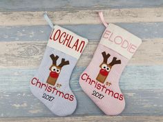 two personalized christmas stockings with reindeer heads on them