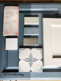 several different types of tile on display in a room with blue walls and flooring